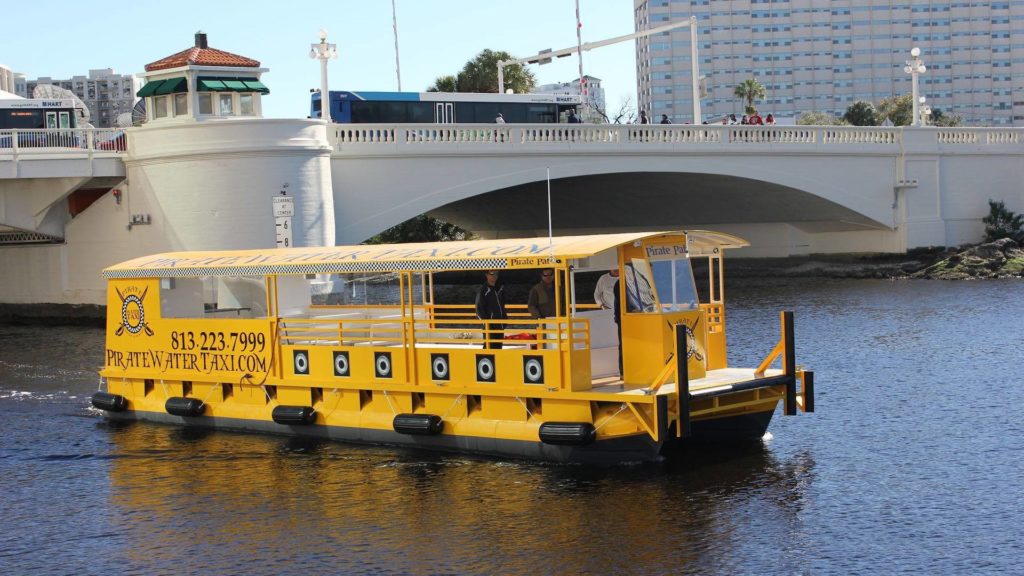 Photo of yellow water taxi boat