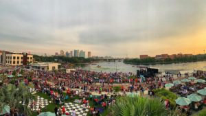 Photo of Tampa residents gathered on the great lawn along the Riverwalk