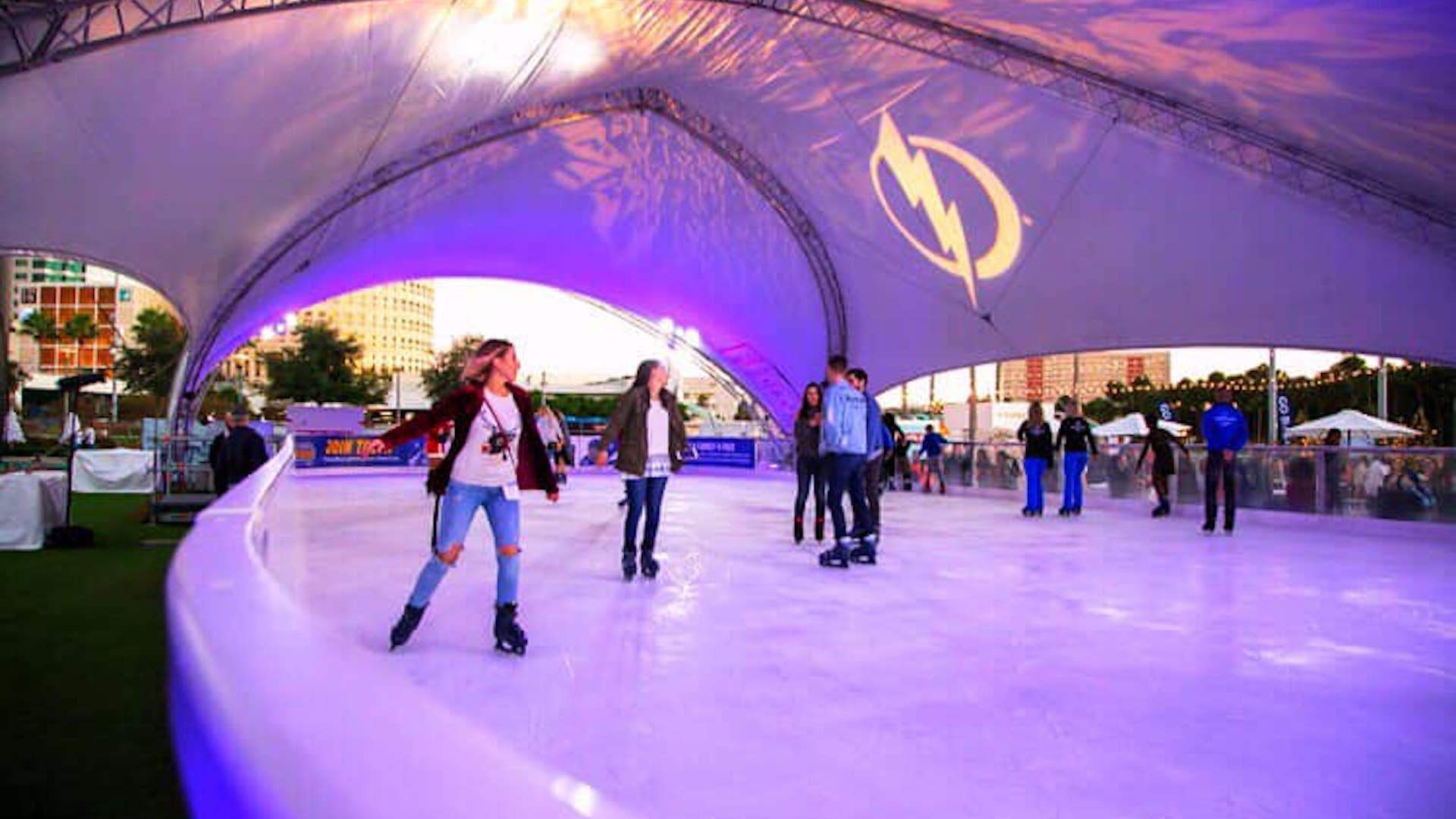 Inside the Curtis Hixon Park waterfront skating rink with purple and blue lights