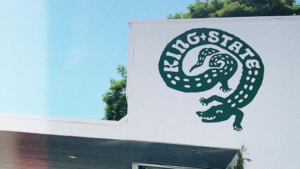 Photo of alligator graphic on the front of a coffee shop