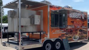 Photo of a bright orange food truck wrap