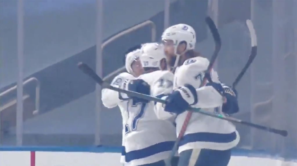 Photo of Lightning players celebrating a goal on the ice