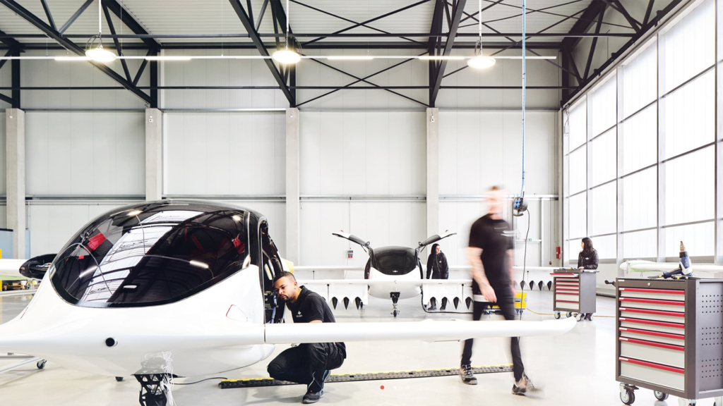 Photo of small five-seater flying vehicles in a warehouse