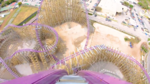 Photo from the top of a massive roller coaster on purple tracks