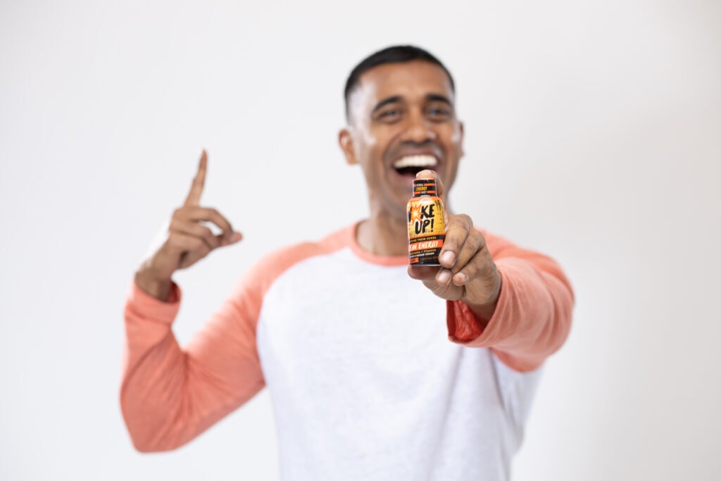 Tampa-based actor, Dilan Jay proudly holds a sample of his new energy shot.