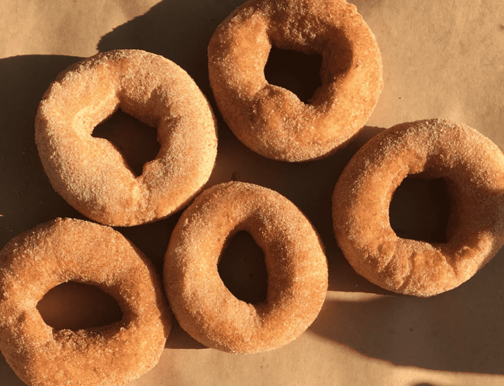 cinnamon sugar donuts laid flat on a table