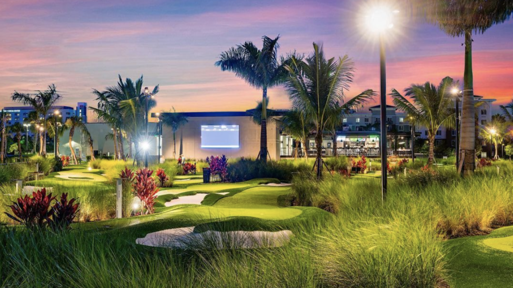 rendering of a high tech mini golf course with bunkers and palm trees