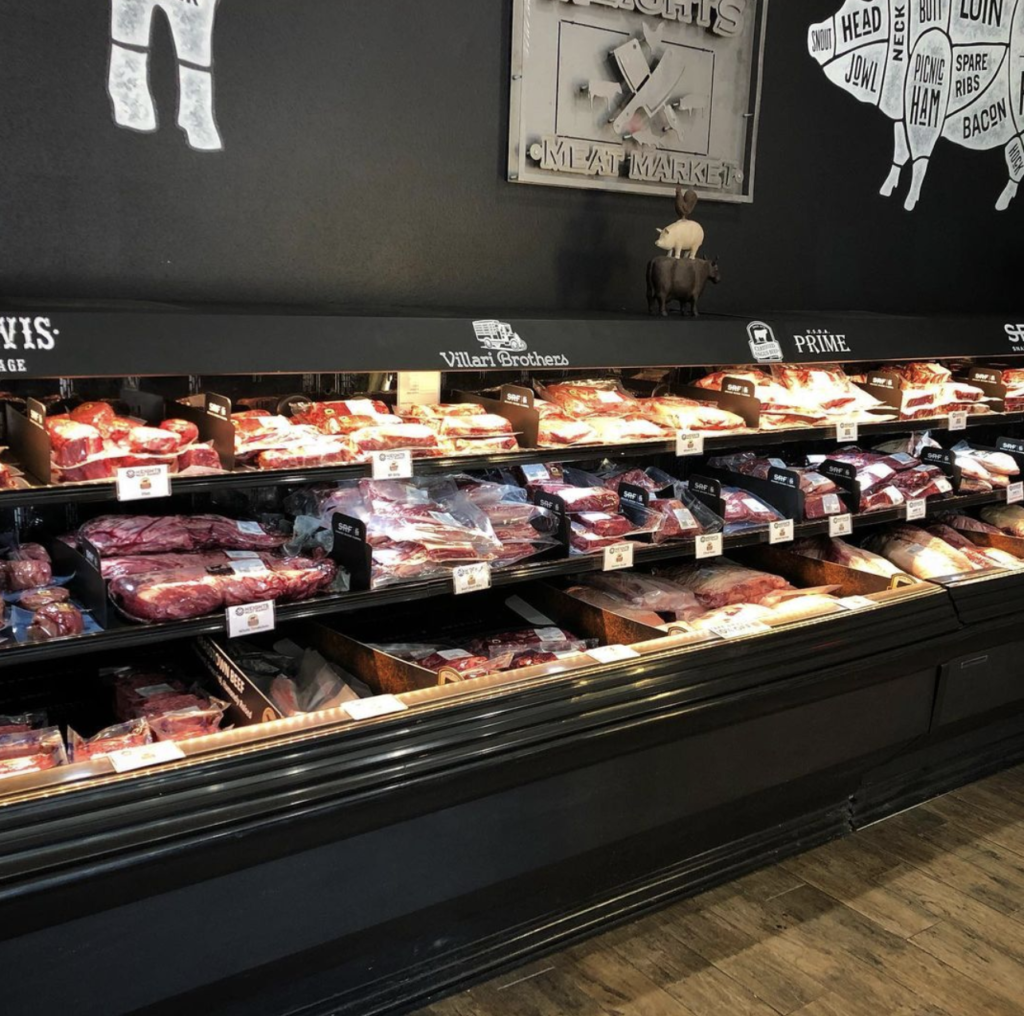 Cold case display of packaged raw meats.