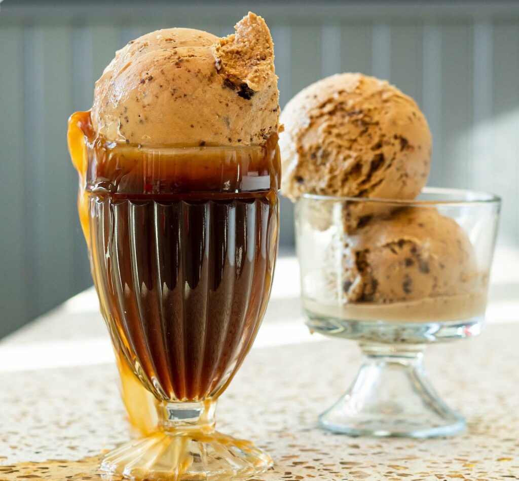 an ice cream root beer float on a granite countertop. 