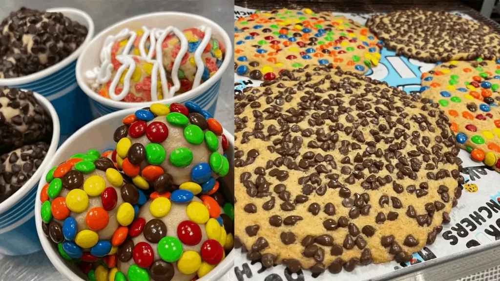 a plate of huge cookies covered in M&Ms and chocolate chips