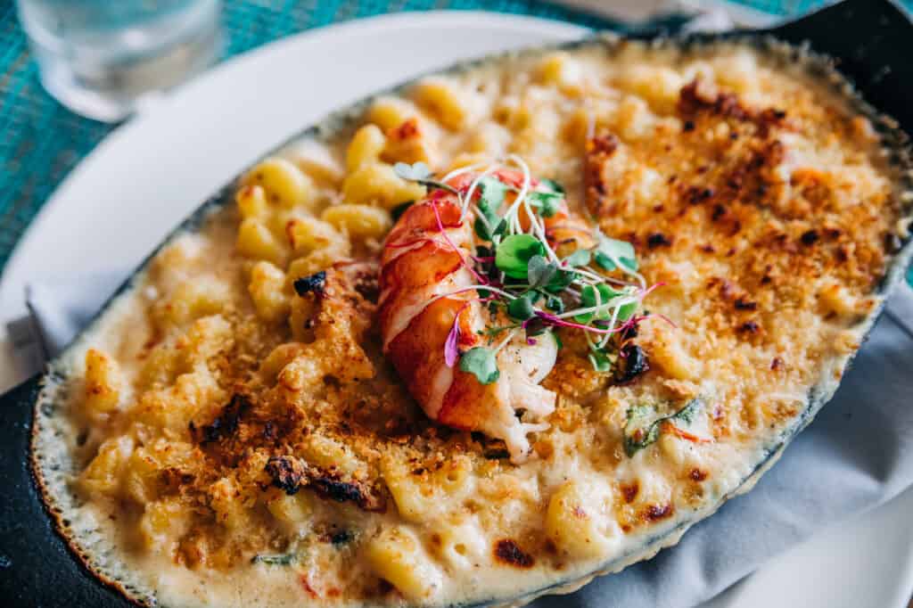  plate of lobster Mac and cheese served in a cast iron skillet