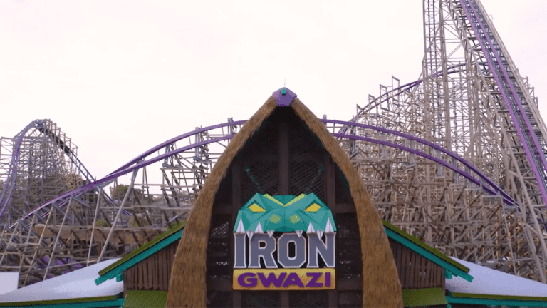 exterior of a large hybrid roller coaster with a snake's head as a logo