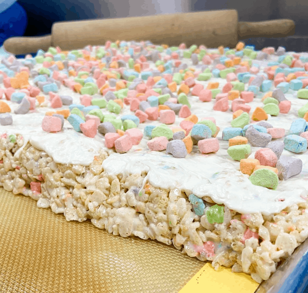 rice Krispy treats covered in frosting and marshmallows