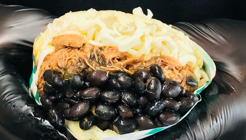 black beans, shredded meat and cheese held inside two fried corn cakes