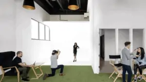 inside a film and photography studio with turf grass and white walls