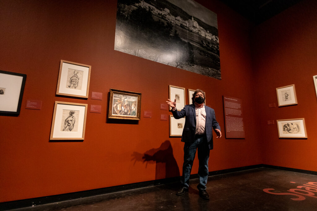 A Dalí Museum employee leads a tour of the new exhibition
