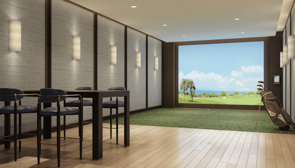 a room with green turf carpeting and a golf course simulator projected on the wall. 