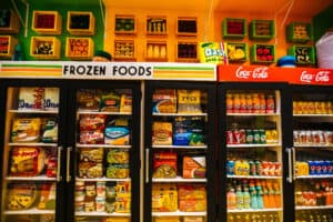 The colorful freezer aisle at Tampa Fresh foods featuring items like simply potatoes, fish sticks, gatorade, bread sticks, and more all crafted from felt by artist, Lucy Sparrow