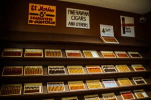 The cigar room featuring felt art cigars by Lucy Sparrow
