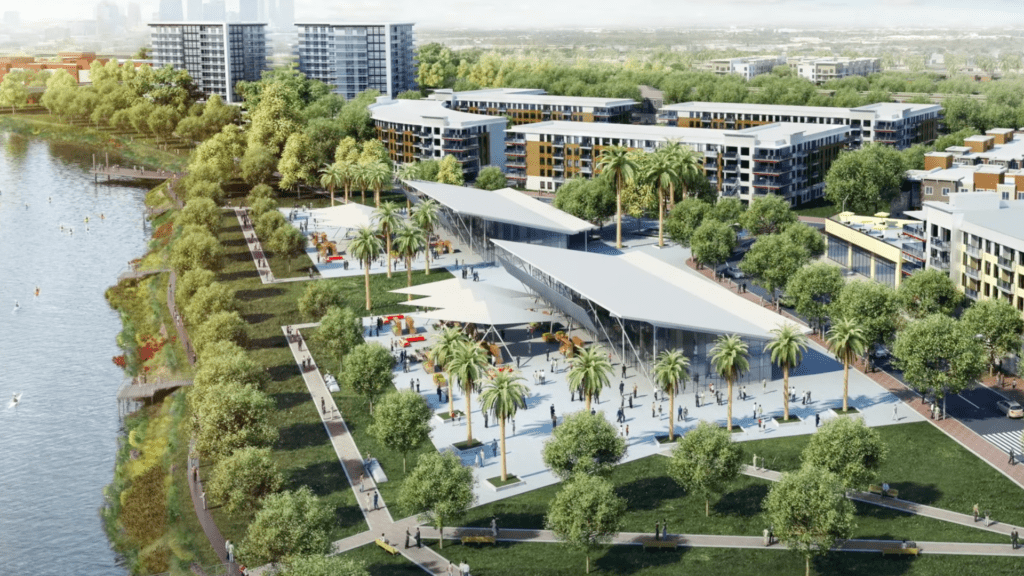 Rendering of a sprawling waterfront district with a concert venue and riverwalk visible.