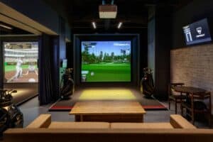 Virtual golf setup with screen inside a room
