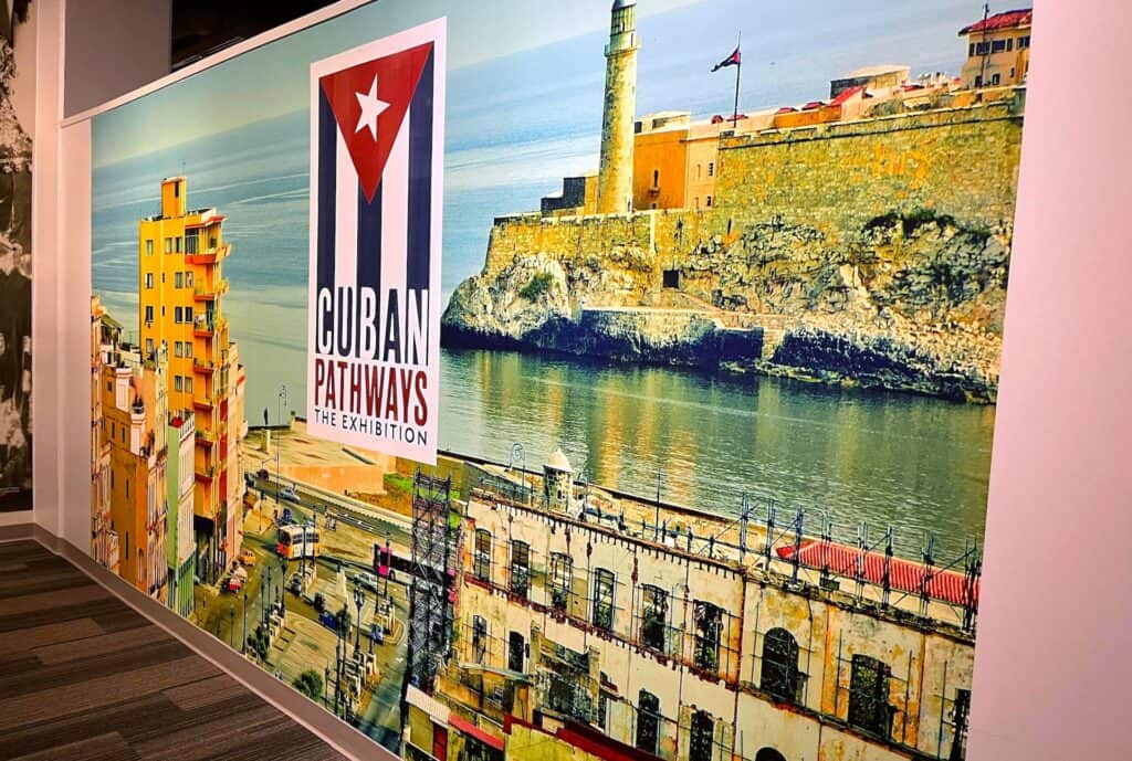 Large scale print showcasing a city with old forts and towers by the water. A large Cuban 