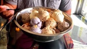 a huge bowl filled with more than 20 scoops of ice cream