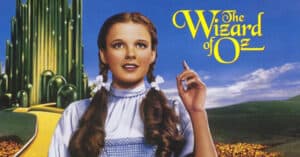Wizard of Oz movie cover with dorthy in pig tails and blue plaid dress