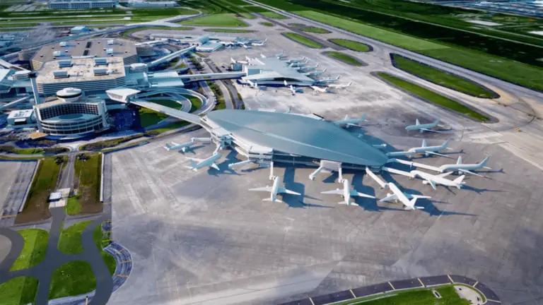 Rendering of an airport terminal from above. Planes are docked at the terminal.