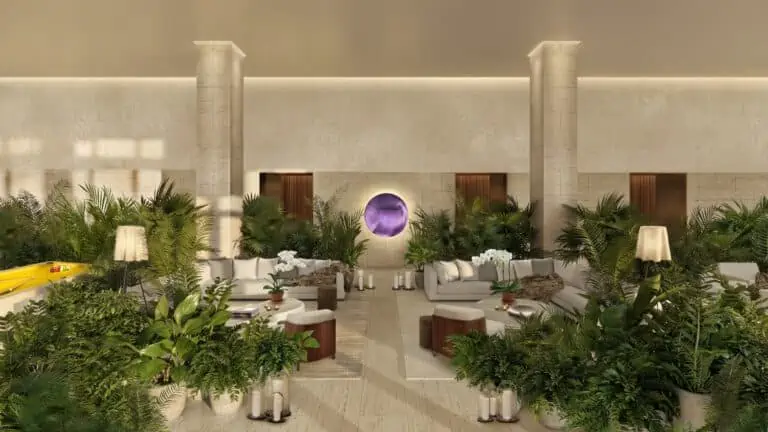 ewnsweing of a restaurant with greenery and a. purple orb art work at the center