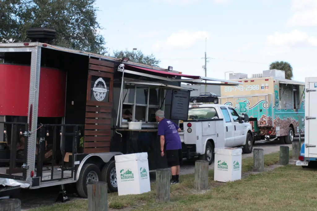 food trucks assembled in a park