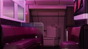 A purple lit logt on a large airbus with leather seats