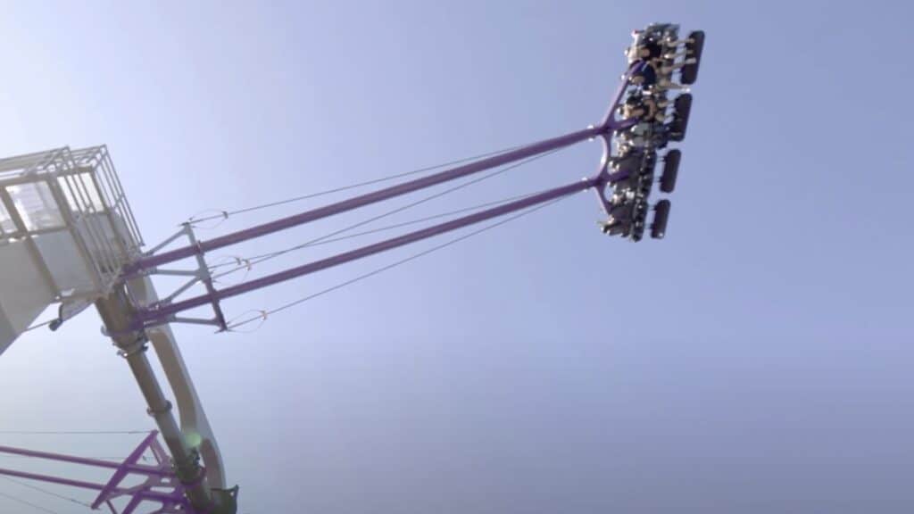 a giant swing soars 135 feet in the air with two rows of riders featured.