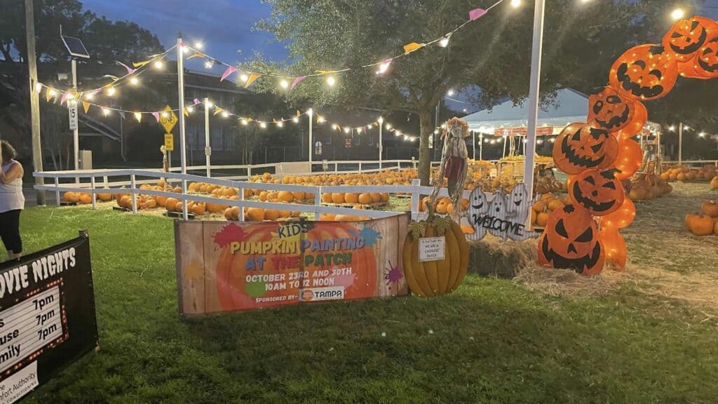 exterior of a pumpkin patch with an orange archway.