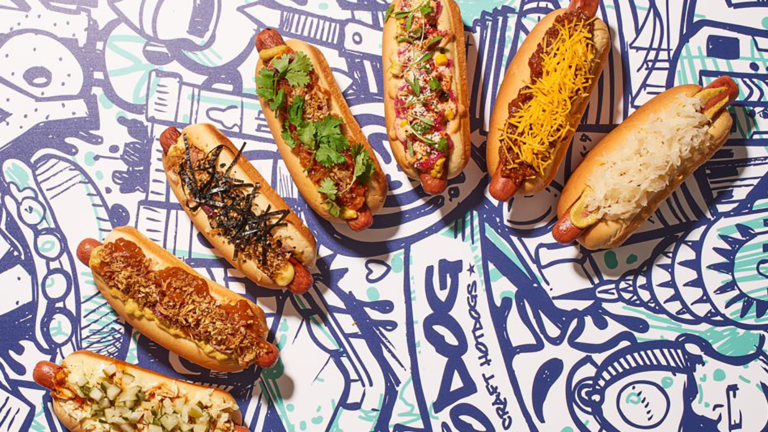 A sequence of hot dogs display on a white and blue background.