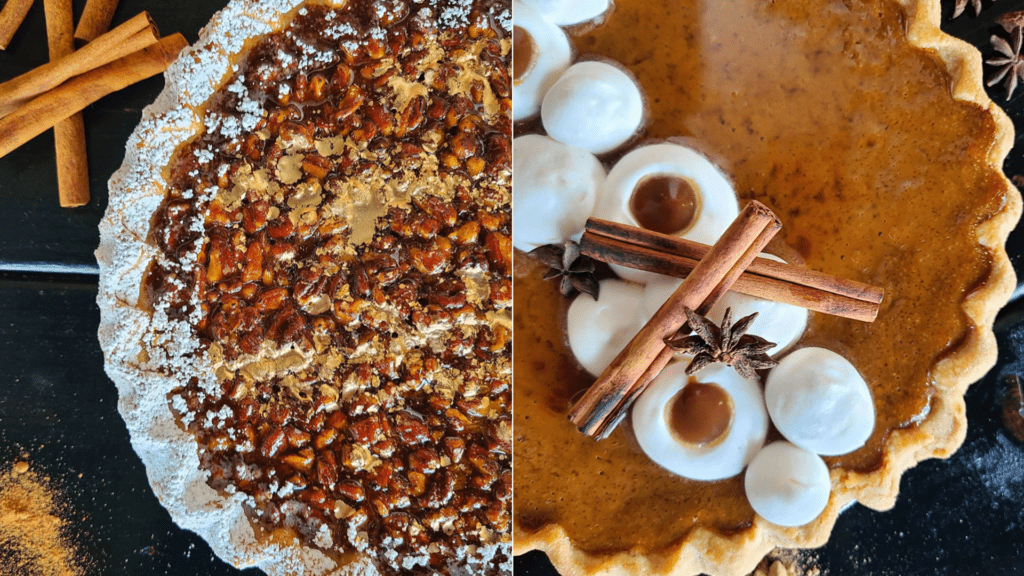 Two pies set on a table. One is a pecan pie with cinnamon sticks on the side. The pie on the right side is a pumpkin pie with dollops of whipped cream on top. 