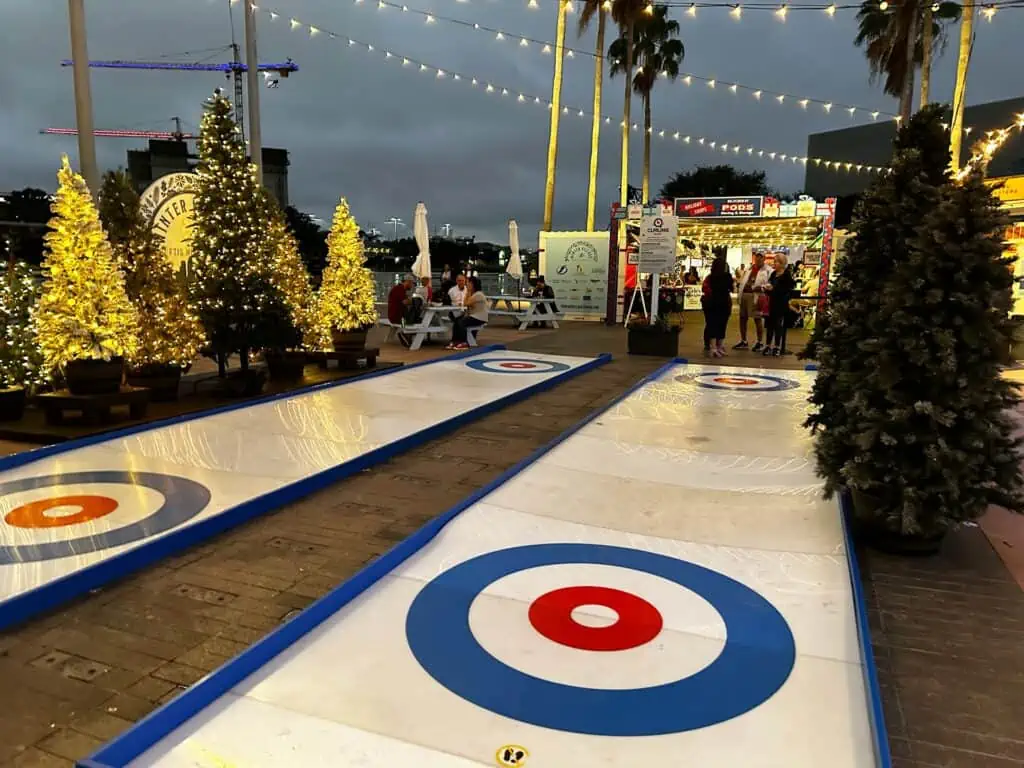 Two curling rinks set up on the Riverwalk in Tampa