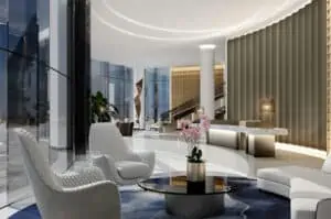 Rendering of a grand lobby with large gold walls and marble floors.