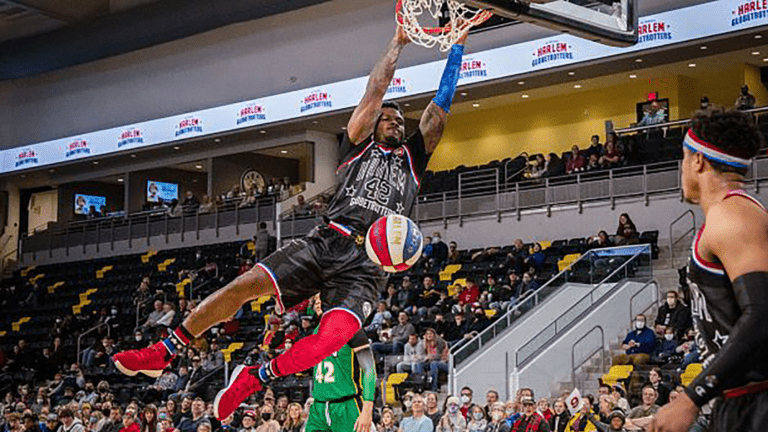 a person dunks a basketball