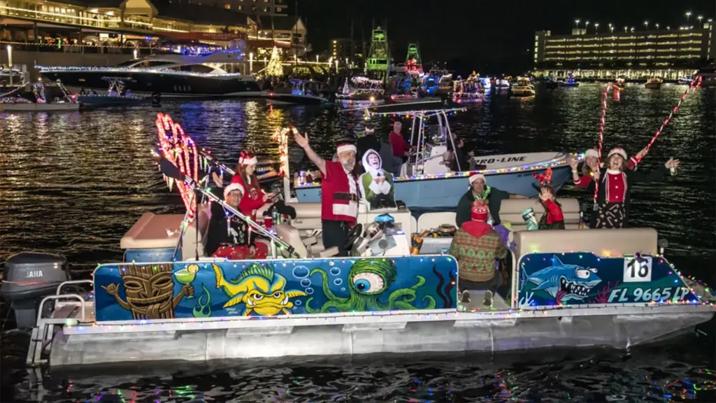 a boat decked out in Christmas decor and holiday lights