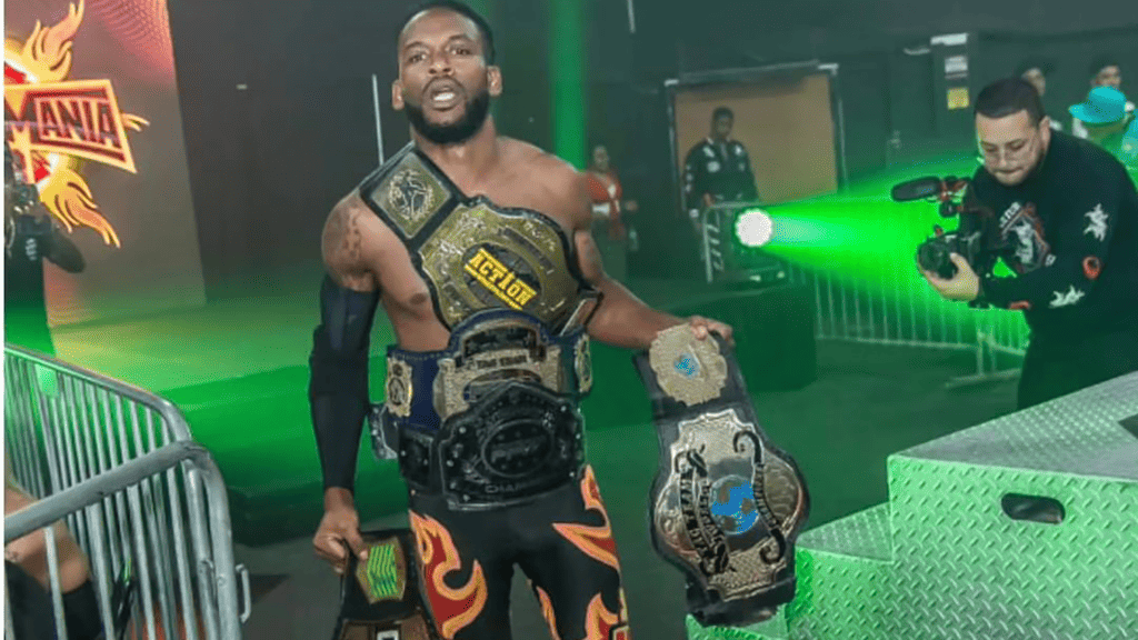 a wrestler wears three championship belts when entering the ring