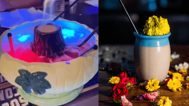 Two tropical tiki glasses filled with flowers and colorful drinks.