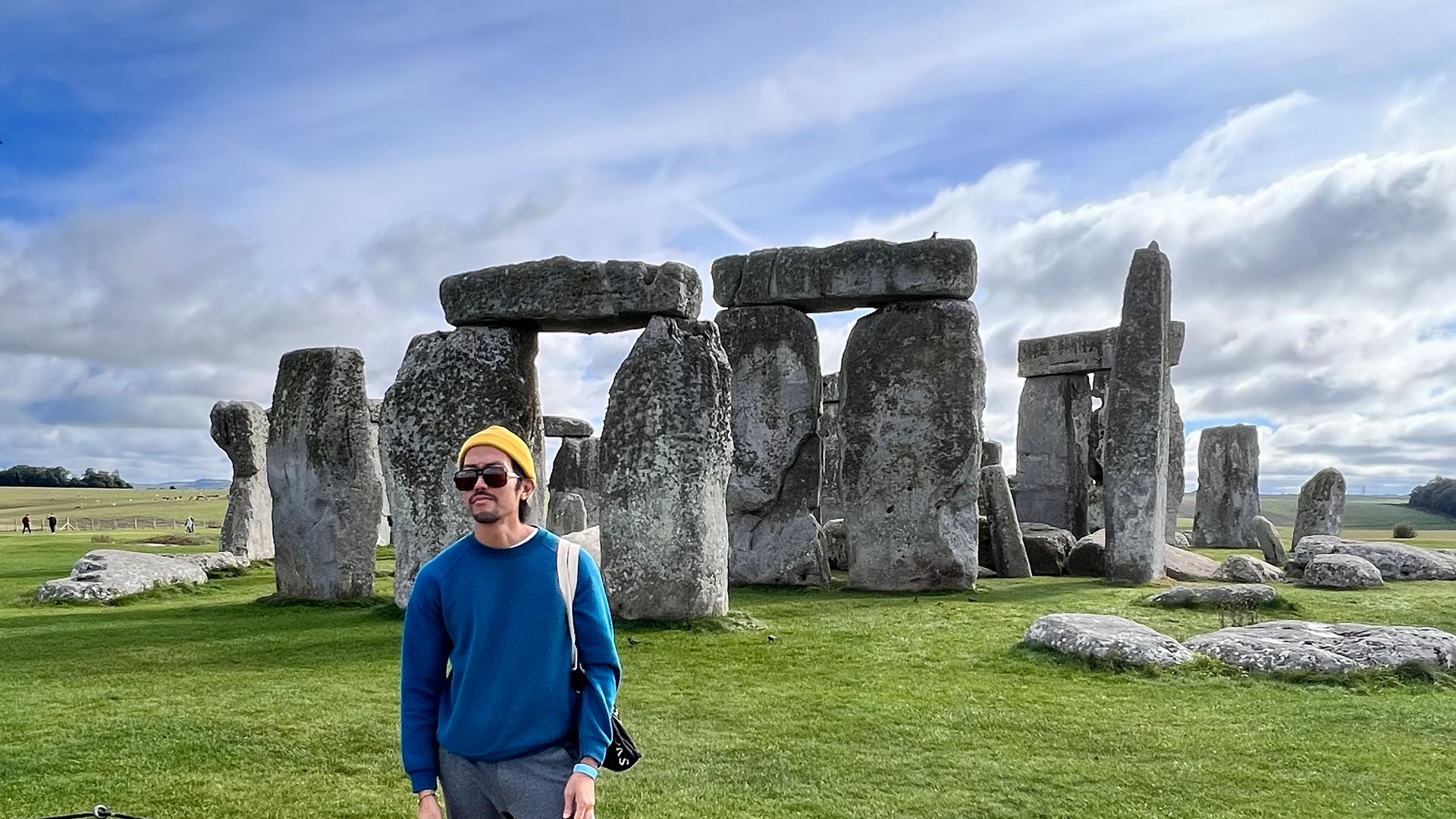 Author standing in front of the stone circle of Stonehenge outside of London