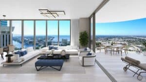 rendering of a top floor lounge area with panoramic windows overlooking the waterfront.