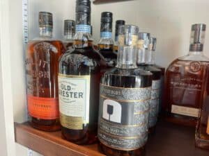 assorted whiskey and bourbon bottles on a shelf