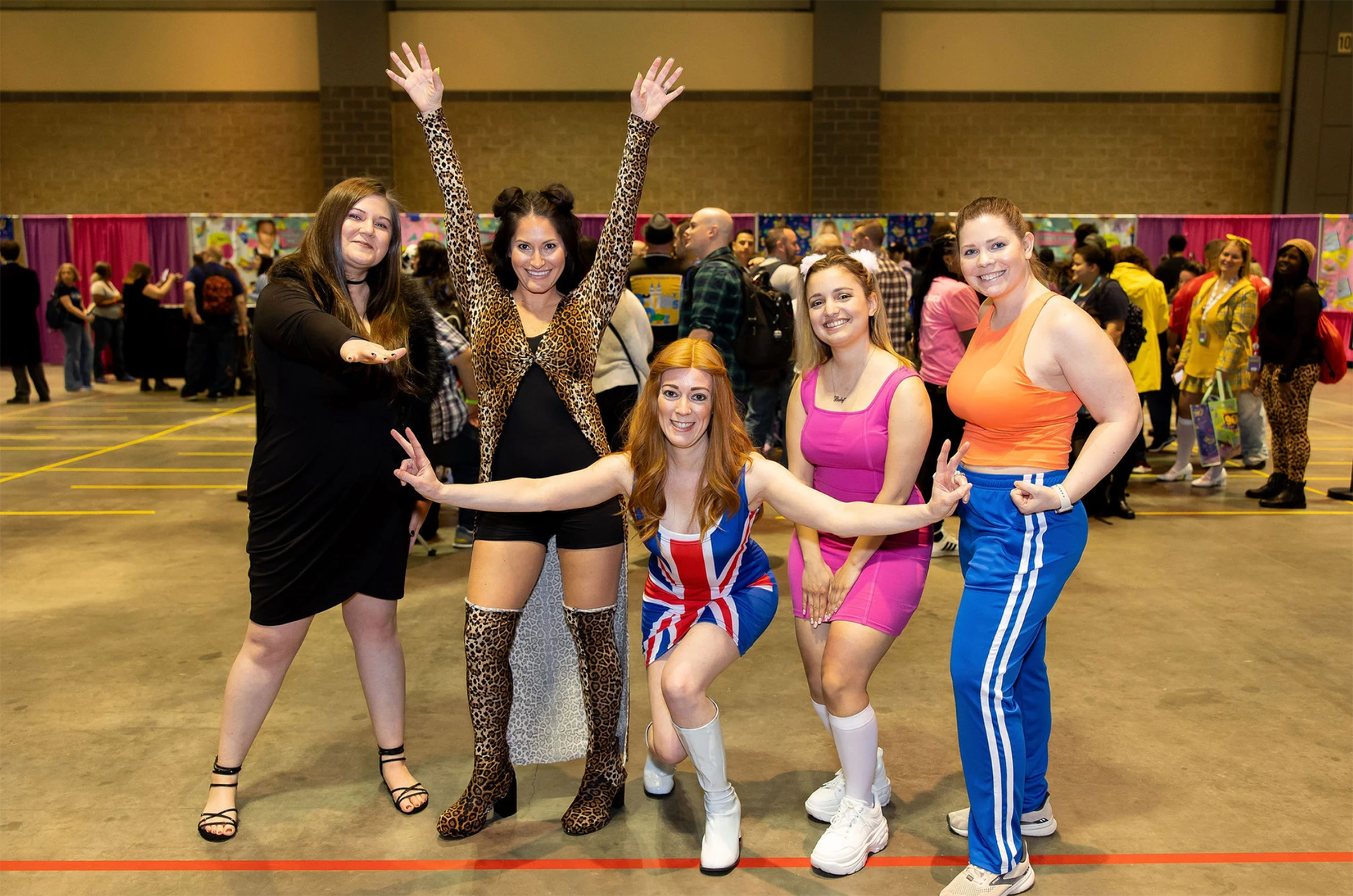 a group of women dressed in costume as the Spice Girls
