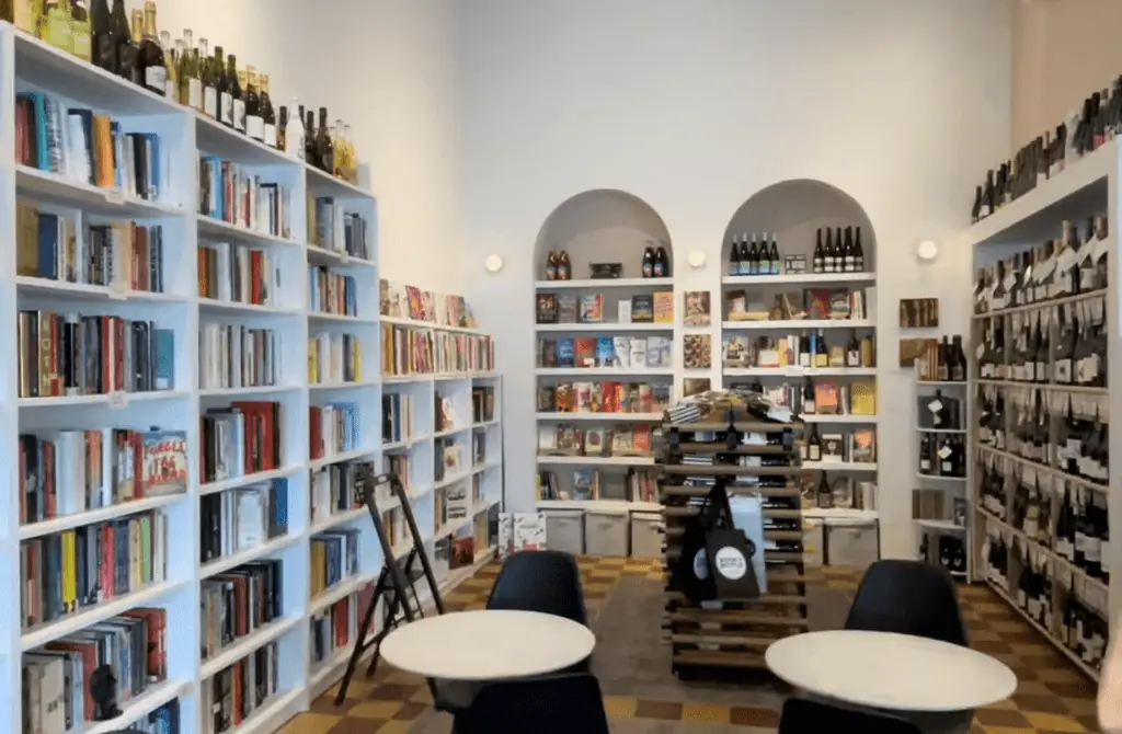 A bookstore with wine shelves 