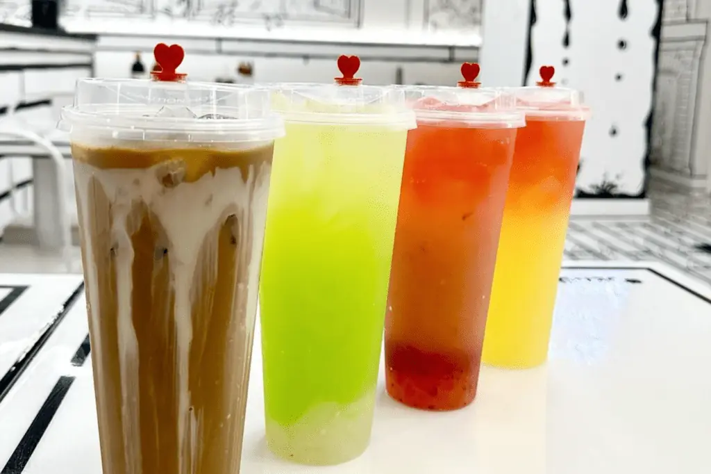 multiple vibrant iced tea drinks with boba