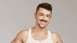 Man in white tank top with a mustache.