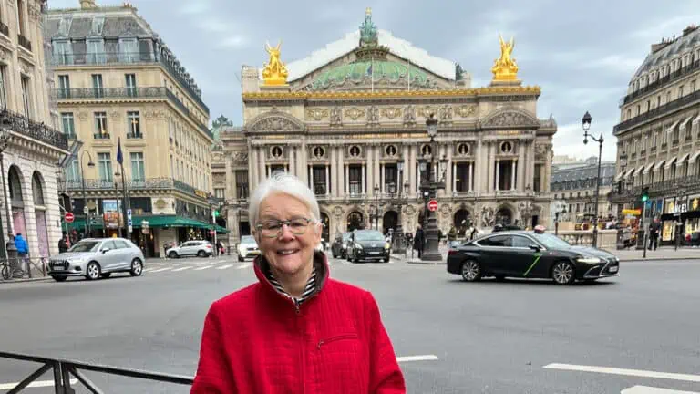 Author standing in front of Palais Garnier in Paris